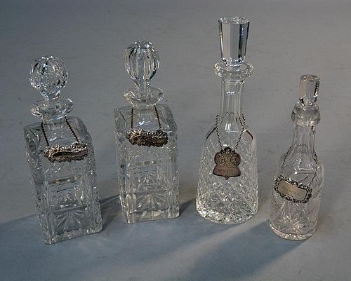 FOUR CUT CRYSTAL DECANTERS WITH