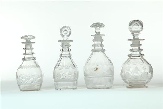 FOUR CUT GLASS DECANTERS.  American
