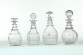 FOUR CUT GLASS DECANTERS.  Ame