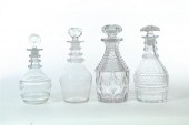 FOUR DECANTERS.  Engraved blow