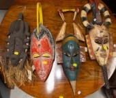 FOUR DECORATIVE AFRICAN MASKS