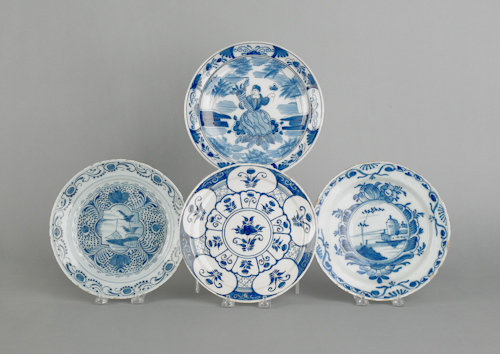 Four Delft blue and white plates
