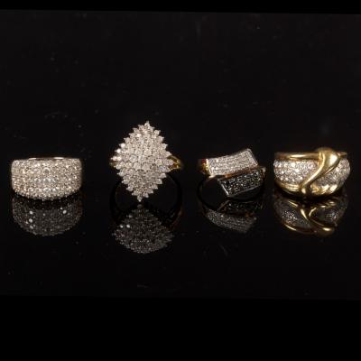 Four diamond dress rings, each