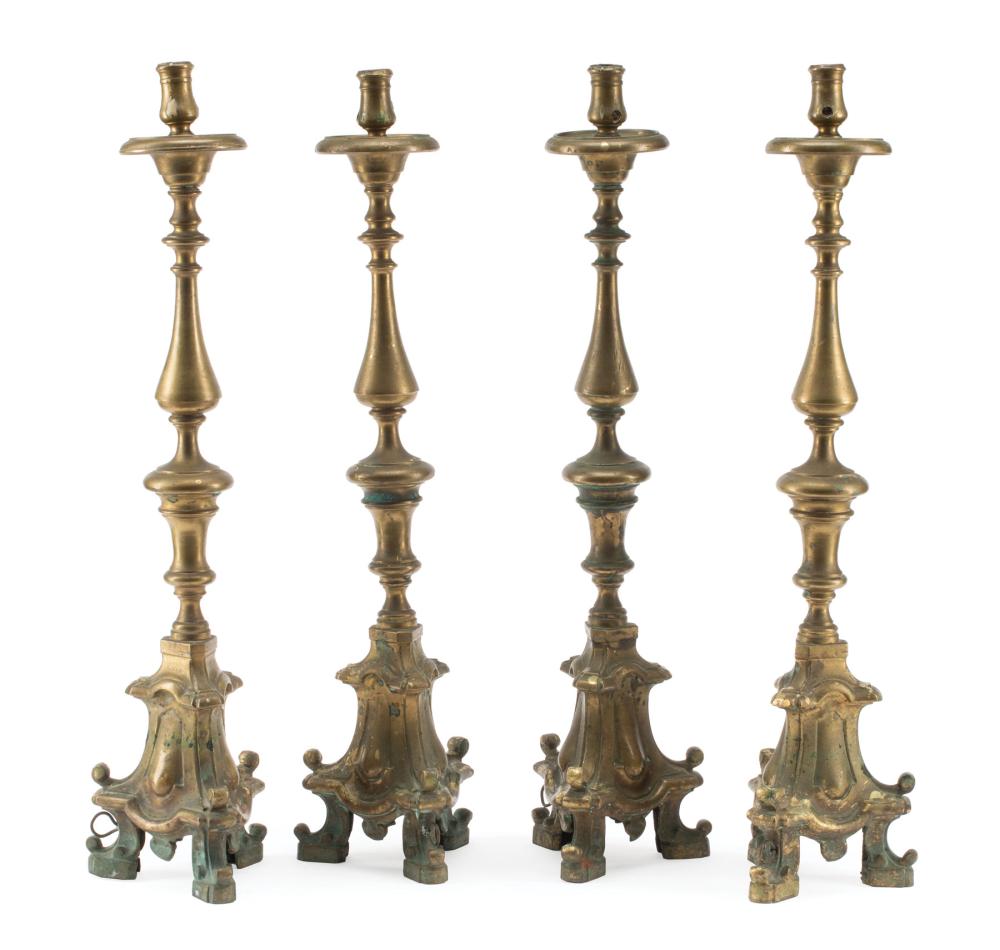 FOUR DUTCH BRASS CANDLESTICKSFour