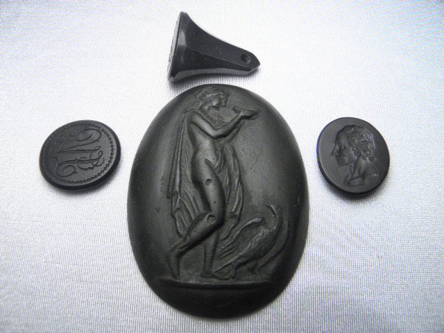 Four early black basalt items: