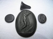 Four early black basalt items: