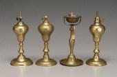 Four early brass lamps: three