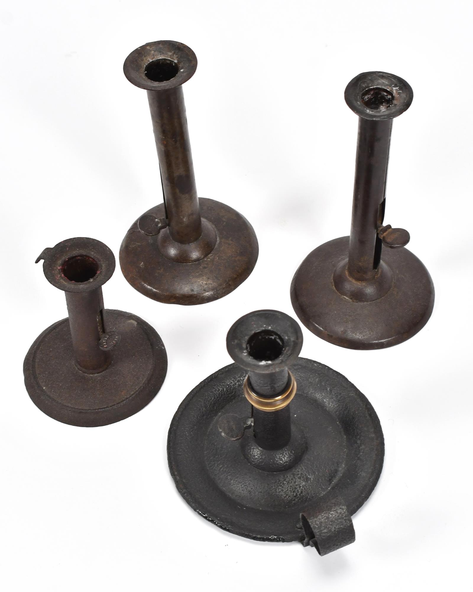 FOUR EARLY IRON HOG SCRAPER