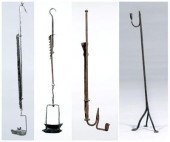 Four early iron lighting devic