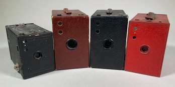 Four early Kodak box cameras,
