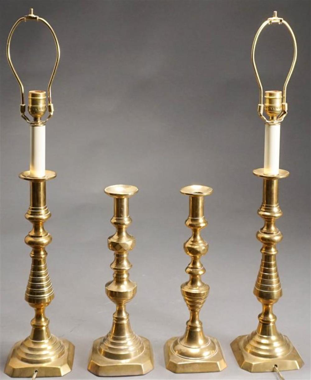 FOUR ENGLISH BRASS CANDLESTICKS