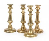 FOUR ENGLISH BRASS CANDLESTICK