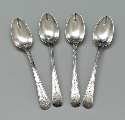 Four Enos Reeves coin spoons: