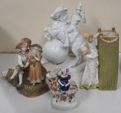 FOUR EUROPEAN PORCELAIN FIGURA