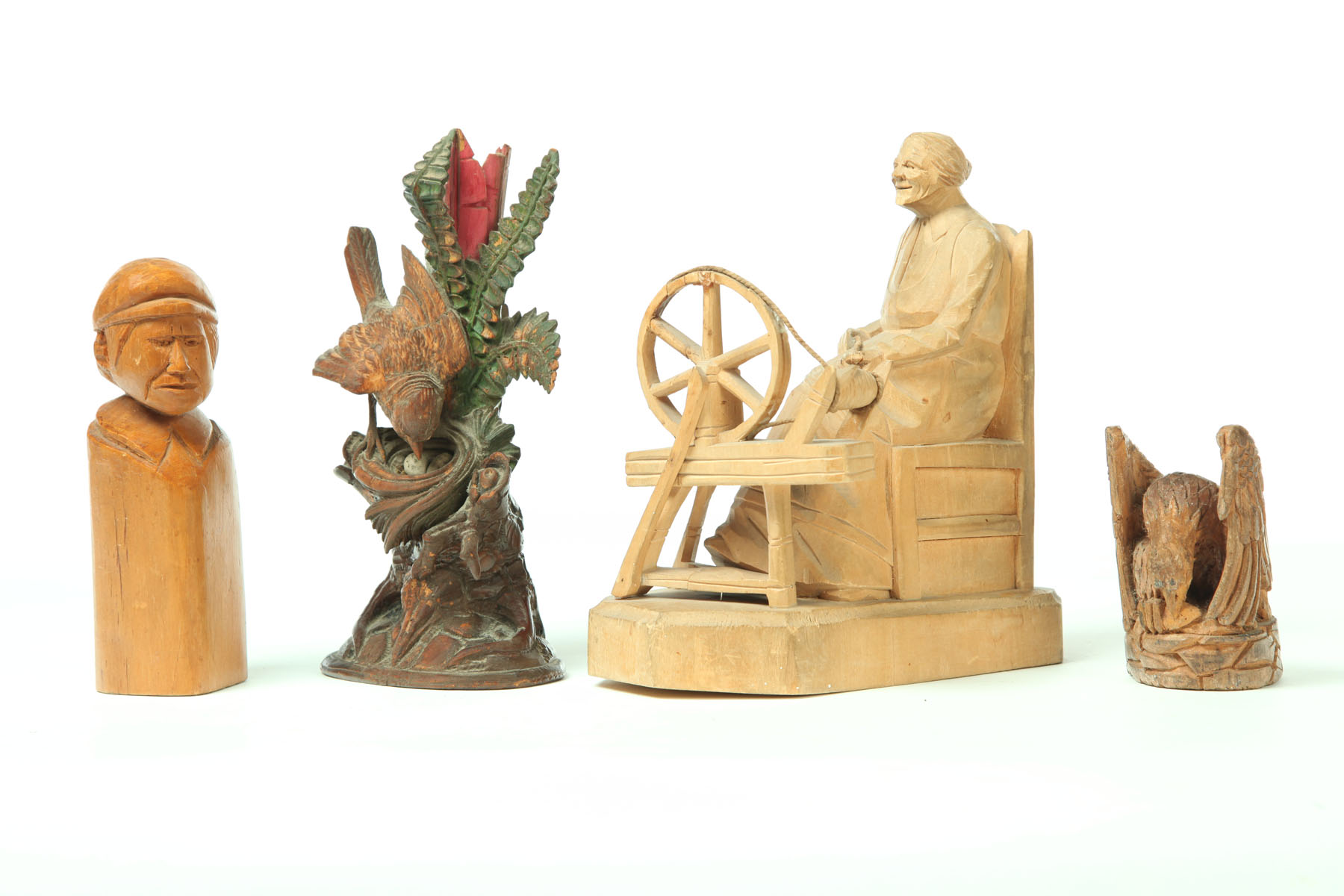 FOUR FOLK ART CARVINGS.  American