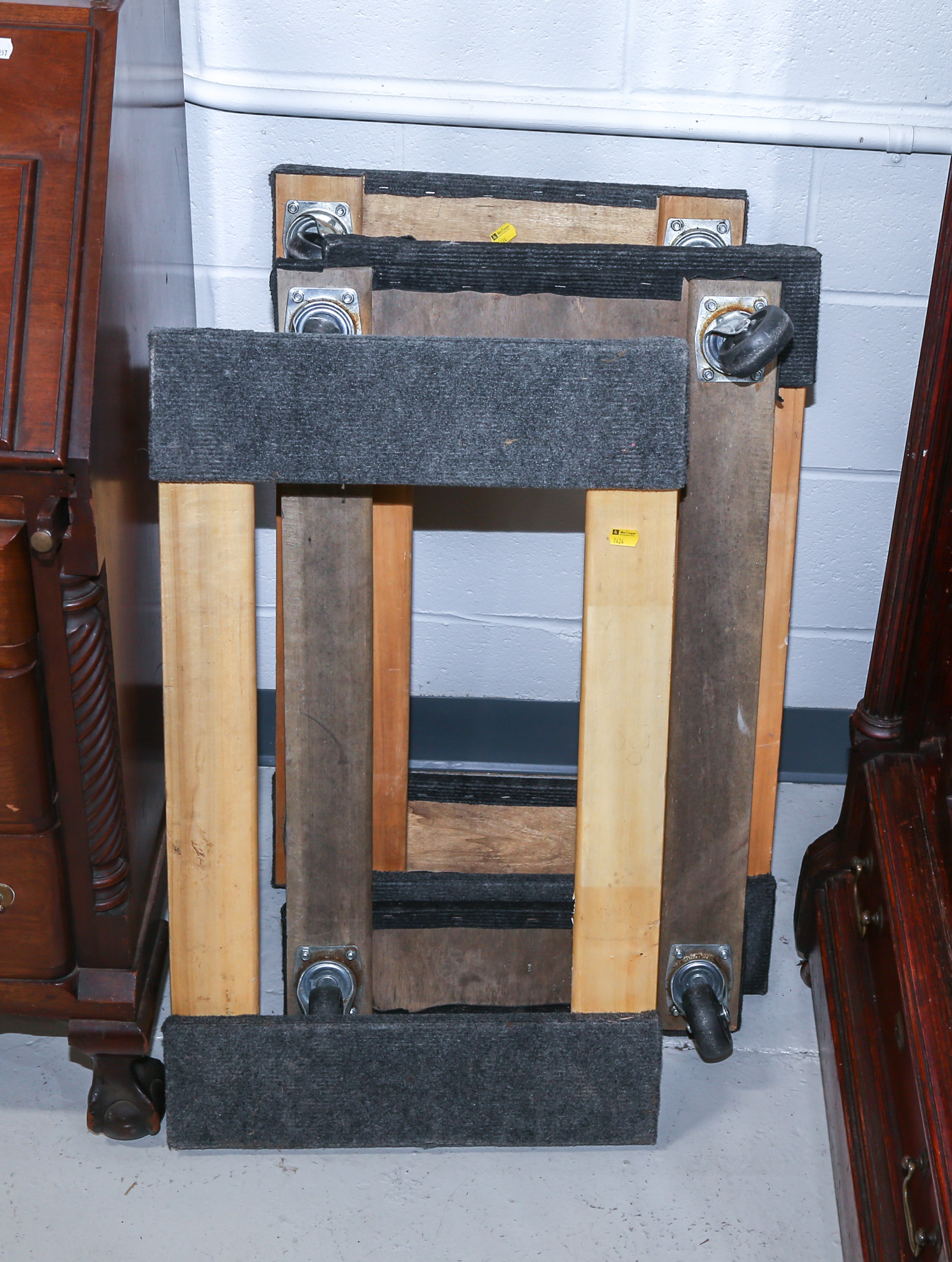 FOUR FULL SIZED FURNITURE DOLLIES .