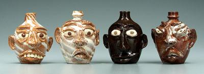 Four G. F. Cole face jugs