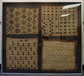 FOUR GEOMETRICALLY EMBROIDERED