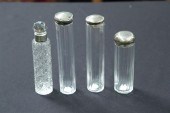 FOUR GLASS AND SILVER DRESSER