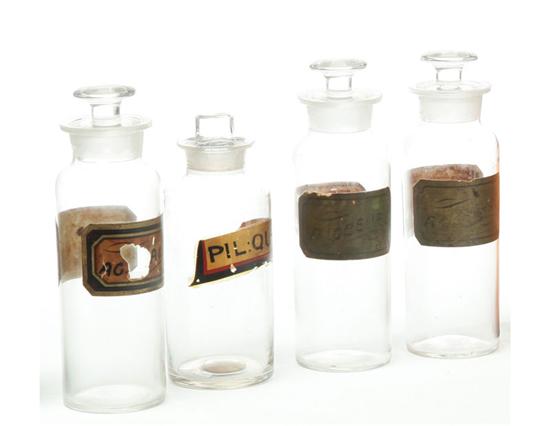 FOUR GLASS APOTHECARY JARS. 