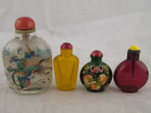 Four glass Chinese snuff bottles.