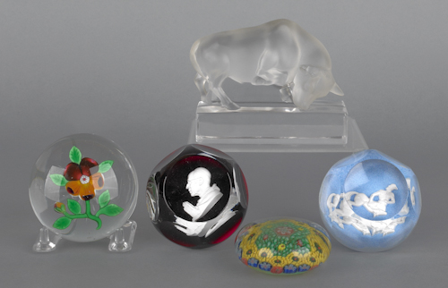 Four glass paperweights to