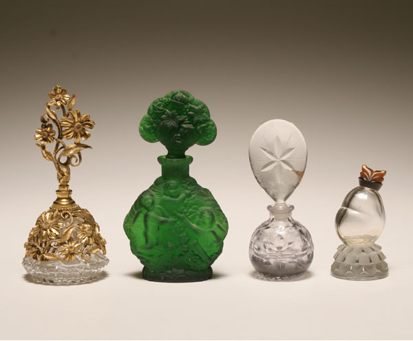 Four glass perfume bottles;