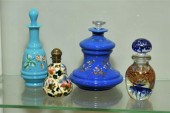 FOUR GLASS PERFUME BOTTLES. On