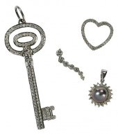 FOUR GOLD AND DIAMOND PENDANTS