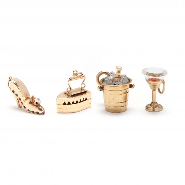 FOUR GOLD CHARMS The first designed