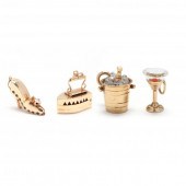 FOUR GOLD CHARMS The first des