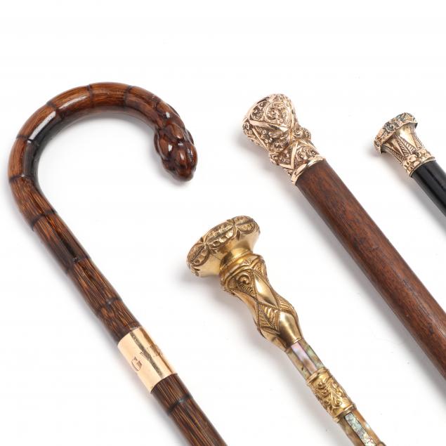 FOUR GOLD FILLED HANDLED CANES Late