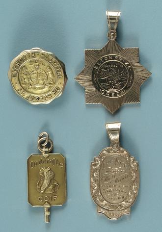 Four gold medallions: two