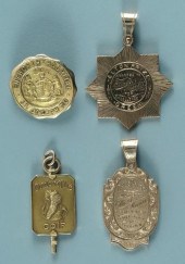 Four gold medallions: two engr