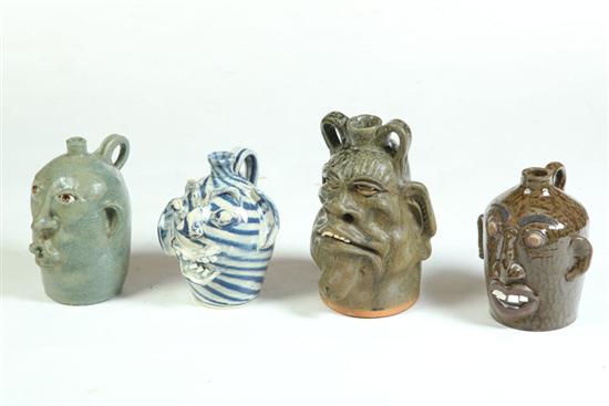 *****FOUR GROTESQUE FACE JUGS. 