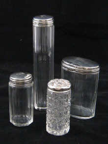 Four hallmarked silver topped