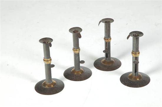 FOUR HOGSCRAPER CANDLESTICKS. 