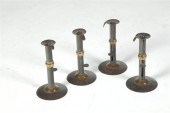 FOUR HOGSCRAPER CANDLESTICKS.