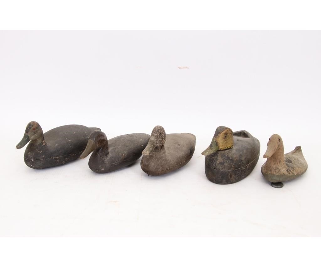 Four hollow duck decoys, all