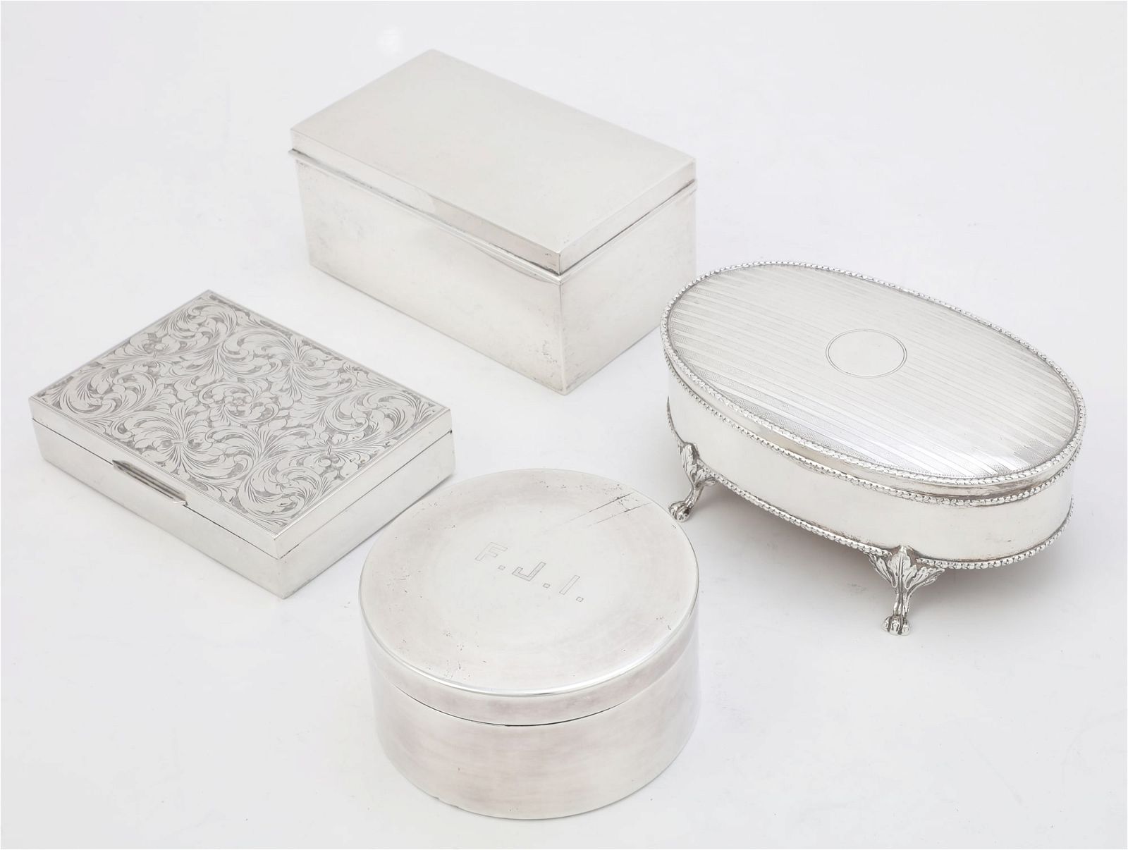 FOUR INTERNATIONAL SILVER TABLE