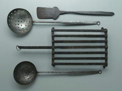Four iron kitchen implements: