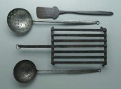Four iron kitchen implements: