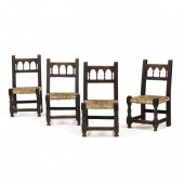 FOUR JACOBEAN CARVED WALNUT SI