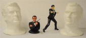 Four James Bond sculptures. Tw