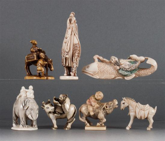 Four Japanese carved ivory netsukes