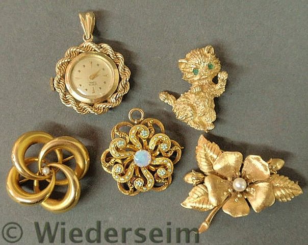 Four ladies 14k yg pins and a 14k