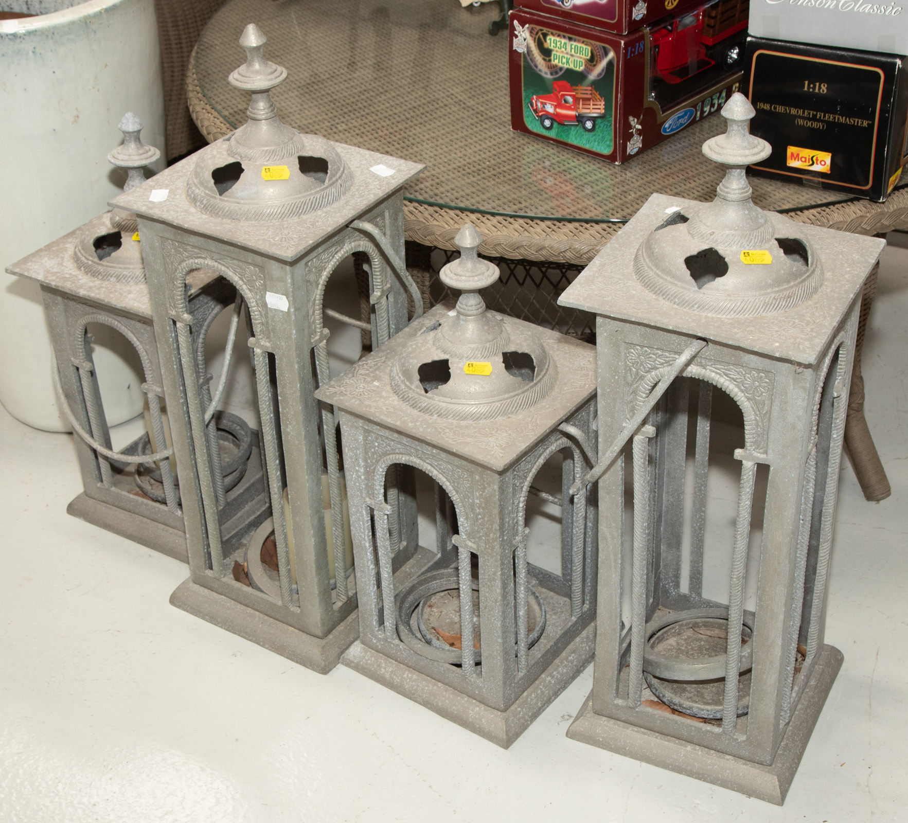 FOUR LARGE METAL DECORATIVE