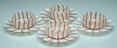 Four latticino bowls, under plates: