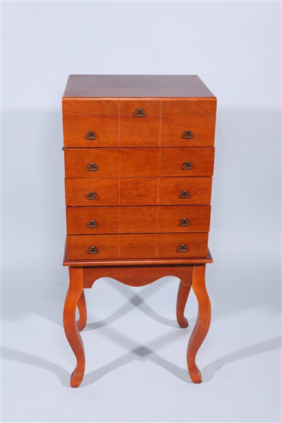 Four legged wooden silver chest