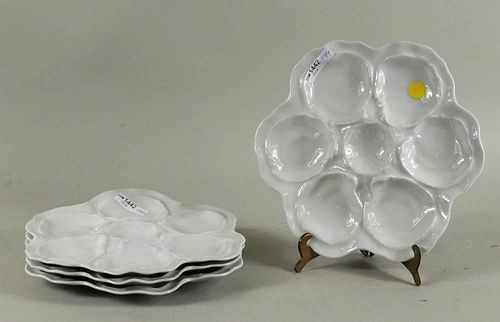 FOUR LIMOGES OYSTER PLATESFour